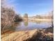 Peaceful pond reflecting the sky and surrounding trees for a serene outdoor setting at 5546/5510 Hoodtown Rd, Sharon, SC 29742