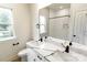 Bright bathroom featuring double sinks, quartz countertops, large mirror and shower at 615 Billingsley Rd, Charlotte, NC 28211