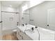 Bright bathroom featuring double sinks, quartz countertops, large mirror and shower at 615 Billingsley Rd, Charlotte, NC 28211