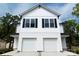 Charming two-story home with two-car garage, black shutters, and white siding at 615 Billingsley Rd, Charlotte, NC 28211