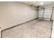 Spacious two-car garage with a gray painted concrete floor, overhead lighting, and white walls at 615 Billingsley Rd, Charlotte, NC 28211