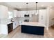 Beautiful kitchen with white cabinets, subway tile backsplash, and island with quartz countertop at 615 Billingsley Rd, Charlotte, NC 28211