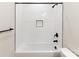 Stylish shower and tub combo with matte black finishes and a built-in storage niche at 615 Billingsley Rd, Charlotte, NC 28211