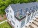 A stunning aerial view displays a modern townhouse with a deck and outdoor seating area at 648 W End Dr, Charlotte, NC 28208