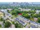 Great aerial view of the townhouse community, the nearby city and surrounding green spaces at 648 W End Dr, Charlotte, NC 28208