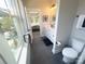 Bright bathroom with white vanity, stylish fixtures, and view to bedroom with plush carpet at 648 W End Dr, Charlotte, NC 28208