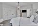 Bright primary bedroom boasts a cozy bed, ample closet space, and ensuite bathroom access at 648 W End Dr, Charlotte, NC 28208