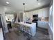 Bright kitchen featuring a central island with seating, stainless steel appliances, and modern finishes at 648 W End Dr, Charlotte, NC 28208