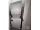 Efficient stacked washer and dryer unit for space-saving convenience at 648 W End Dr, Charlotte, NC 28208