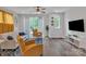 Bright living room features stylish decor, hardwood floors, and large windows offering ample natural light at 648 W End Dr, Charlotte, NC 28208