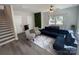 Spacious living room with modern furniture, including a navy blue sectional, and a statement wall at 648 W End Dr, Charlotte, NC 28208