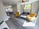Living room features a ceiling fan and a dining area with seating for four at 648 W End Dr, Charlotte, NC 28208