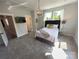 Main bedroom features a modern chandelier, and ample natural light at 648 W End Dr, Charlotte, NC 28208