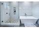 Modern bathroom featuring a glass-enclosed shower and a luxurious soaking tub at 7005 W Duncan Rd, Indian Trail, NC 28079