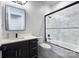 Bathroom with marble tiling in the shower and an updated vanity at 7005 W Duncan Rd, Indian Trail, NC 28079