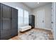 Neutral bedroom featuring hardwood floors, a bright window, and closet wardrobes at 7005 W Duncan Rd, Indian Trail, NC 28079