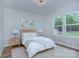 Inviting bedroom with hardwood floors, natural light from large windows, and simple decor at 7005 W Duncan Rd, Indian Trail, NC 28079
