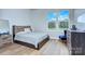 This bedroom features hardwood floors, neutral paint and large windows at 7005 W Duncan Rd, Indian Trail, NC 28079