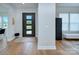 Inviting foyer with hardwood floors, modern front door, and bright interior at 7005 W Duncan Rd, Indian Trail, NC 28079