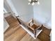 Staircase with wooden steps, black iron railing, and light-colored walls at 7005 W Duncan Rd, Indian Trail, NC 28079