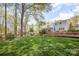 Large backyard with mature trees and landscaping at 726 Grandview Ne Dr, Concord, NC 28025