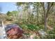 View of backyard with storage shed and lush landscaping at 726 Grandview Ne Dr, Concord, NC 28025