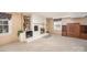 Finished basement with brick fireplace flanked by built-in bookshelves at 726 Grandview Ne Dr, Concord, NC 28025