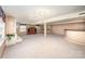 Spacious basement area with brick fireplace, white brick bar, and carpeting at 726 Grandview Ne Dr, Concord, NC 28025