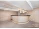 Finished basement with a bar featuring white brick and under-cabinet lighting at 726 Grandview Ne Dr, Concord, NC 28025