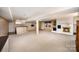 Finished basement featuring a fireplace, bar area, and carpeting at 726 Grandview Ne Dr, Concord, NC 28025