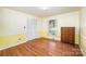 Comfortable bedroom with hardwood floors, closet with bi-fold doors, and natural light from a window at 726 Grandview Ne Dr, Concord, NC 28025