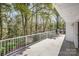 Large outdoor deck with white railing and wooded backyard views at 726 Grandview Ne Dr, Concord, NC 28025