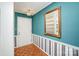 Inviting foyer features parquet floors, classic striped wallpaper, and decorative mirror at 726 Grandview Ne Dr, Concord, NC 28025