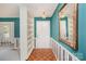 Bright foyer features parquet floors, classic striped wallpaper, and built-in shelving at 726 Grandview Ne Dr, Concord, NC 28025