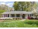 Charming single-story home with a covered front porch and well-maintained landscaping at 726 Grandview Ne Dr, Concord, NC 28025