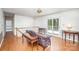 Spacious living area with hardwood floors, ceiling fan, and access to an outdoor balcony at 726 Grandview Ne Dr, Concord, NC 28025