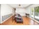 Spacious living area with hardwood floors, ceiling fan, and access to the outdoors at 726 Grandview Ne Dr, Concord, NC 28025