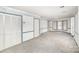 Bright living room with gray carpet, decorative wallpaper and blue trim, plus bay window and closet at 726 Grandview Ne Dr, Concord, NC 28025