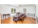 Bright living area with hardwood floors, a ceiling fan, and access to backyard views at 726 Grandview Ne Dr, Concord, NC 28025