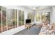 Bright sunroom with walls of windows providing views of the surrounding landscape at 726 Grandview Ne Dr, Concord, NC 28025