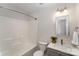 Clean bathroom with a tub and shower combo, toilet, modern vanity and a mirror at 7445 Abigail Glen Dr, Charlotte, NC 28212