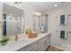 Bright bathroom featuring a double vanity, modern fixtures, and a walk-in shower with white tiling at 7445 Abigail Glen Dr, Charlotte, NC 28212