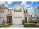 Charming townhome with a garage and well-maintained landscaping in a desirable neighborhood at 7445 Abigail Glen Dr, Charlotte, NC 28212