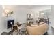 Cozy living room with fireplace, stylish furniture, and ample natural light at 7445 Abigail Glen Dr, Charlotte, NC 28212