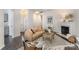 Spacious living room featuring a fireplace, stylish decor, and an open layout at 7445 Abigail Glen Dr, Charlotte, NC 28212
