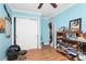 Bedroom featuring hardwood floors, fan, closet and ample shelving at 8301 Washington Blvd, Charlotte, NC 28262