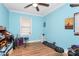 Cozy bedroom with hardwood floors, ceiling fan, and natural light at 8301 Washington Blvd, Charlotte, NC 28262