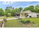 Well-maintained home features a convenient carport, mature landscaping, and a welcoming exterior at 8301 Washington Blvd, Charlotte, NC 28262