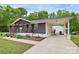 Charming single story home boasts a covered front porch and convenient carport perfect for outdoor living at 8301 Washington Blvd, Charlotte, NC 28262