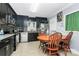 Bright kitchen with dining area offers stainless steel appliances and a window overlooking the backyard at 8301 Washington Blvd, Charlotte, NC 28262